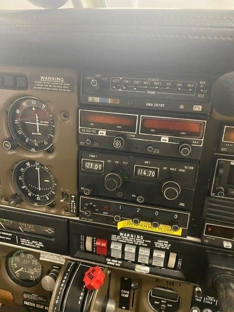 Close-up of the aircraft's instrument panel, showing the avionics and controls.