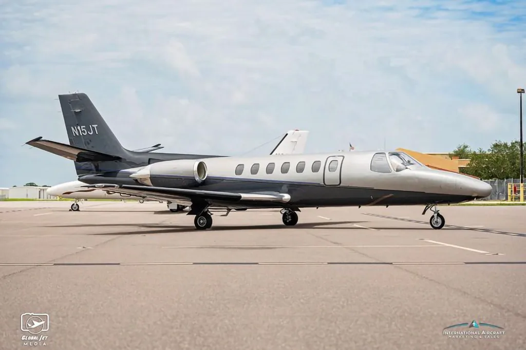 A three-quarter front view of the N15JT Cessna Citation X business jet parked on an airfield.