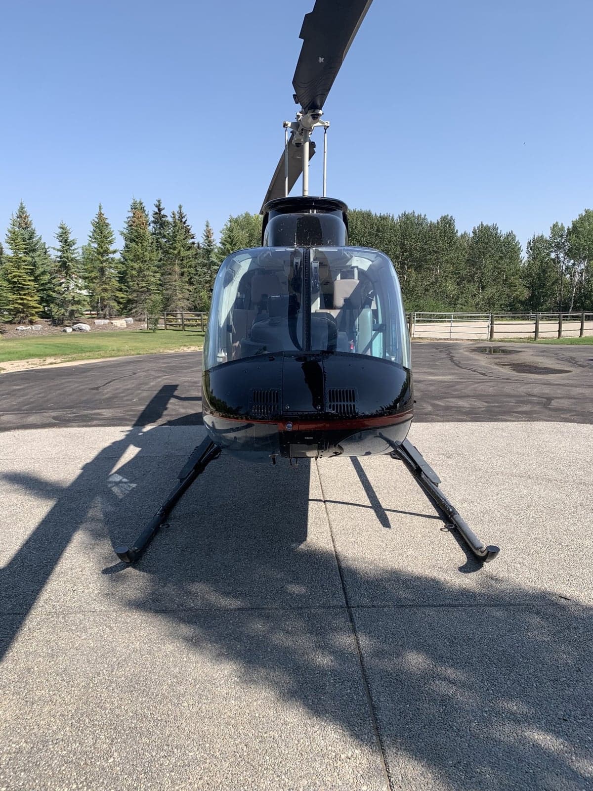 Front view of the Bell 407 helicopter on the ground.