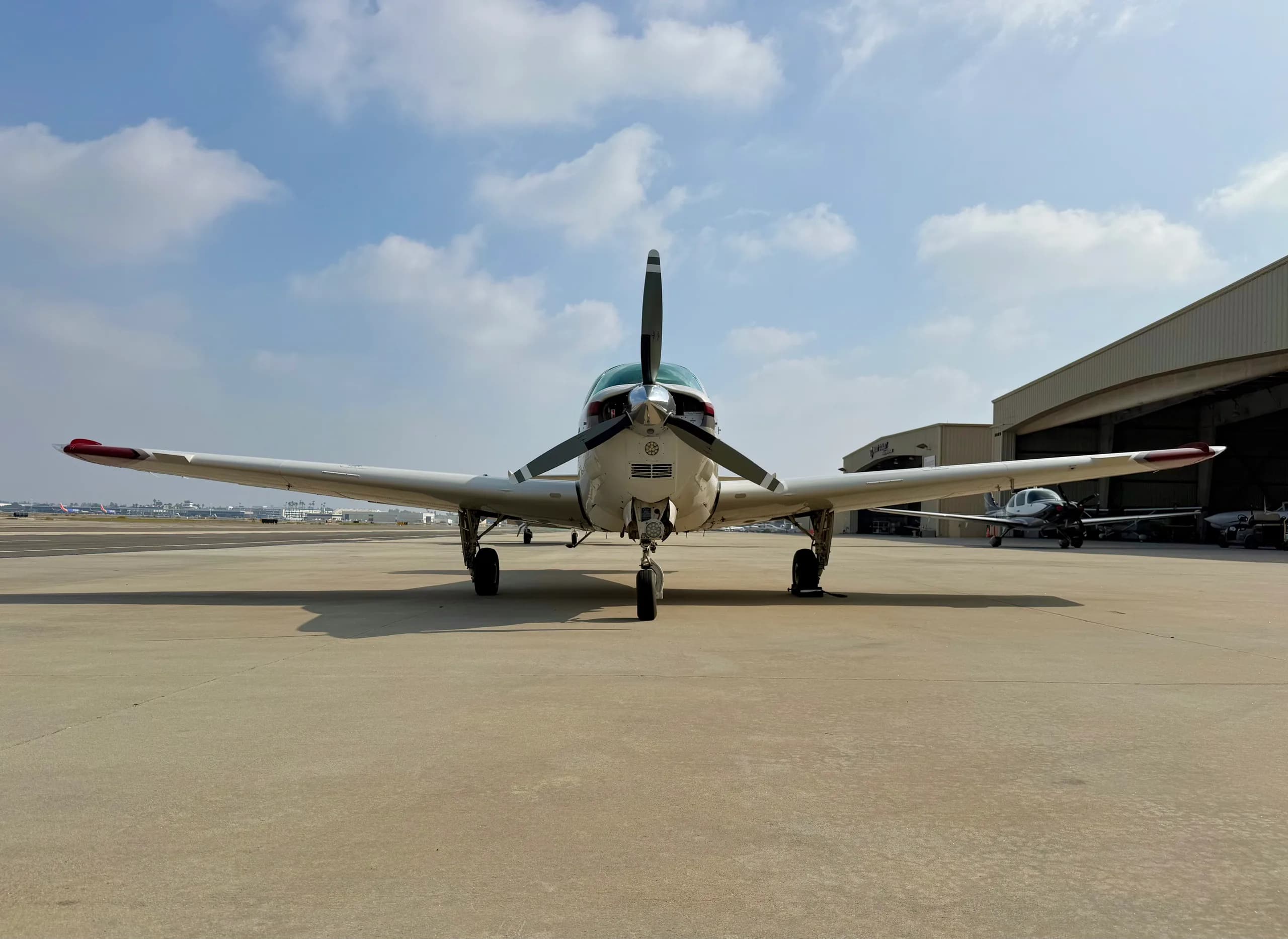 Front view of a Beechcraft Bonanza N3228W on the tarmac.