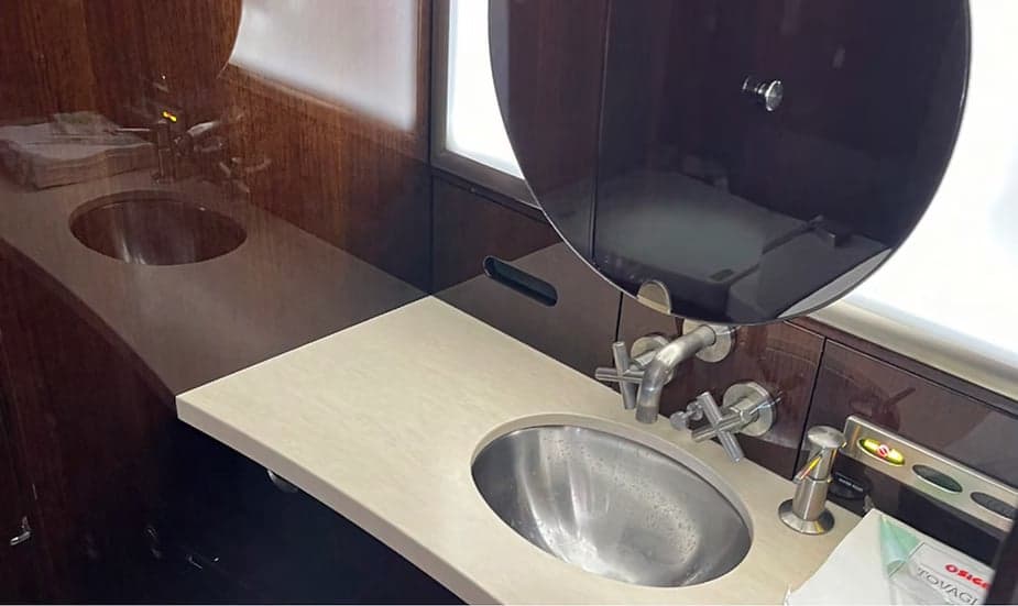 Close-up of the aircraft's lavatory sink and countertop.