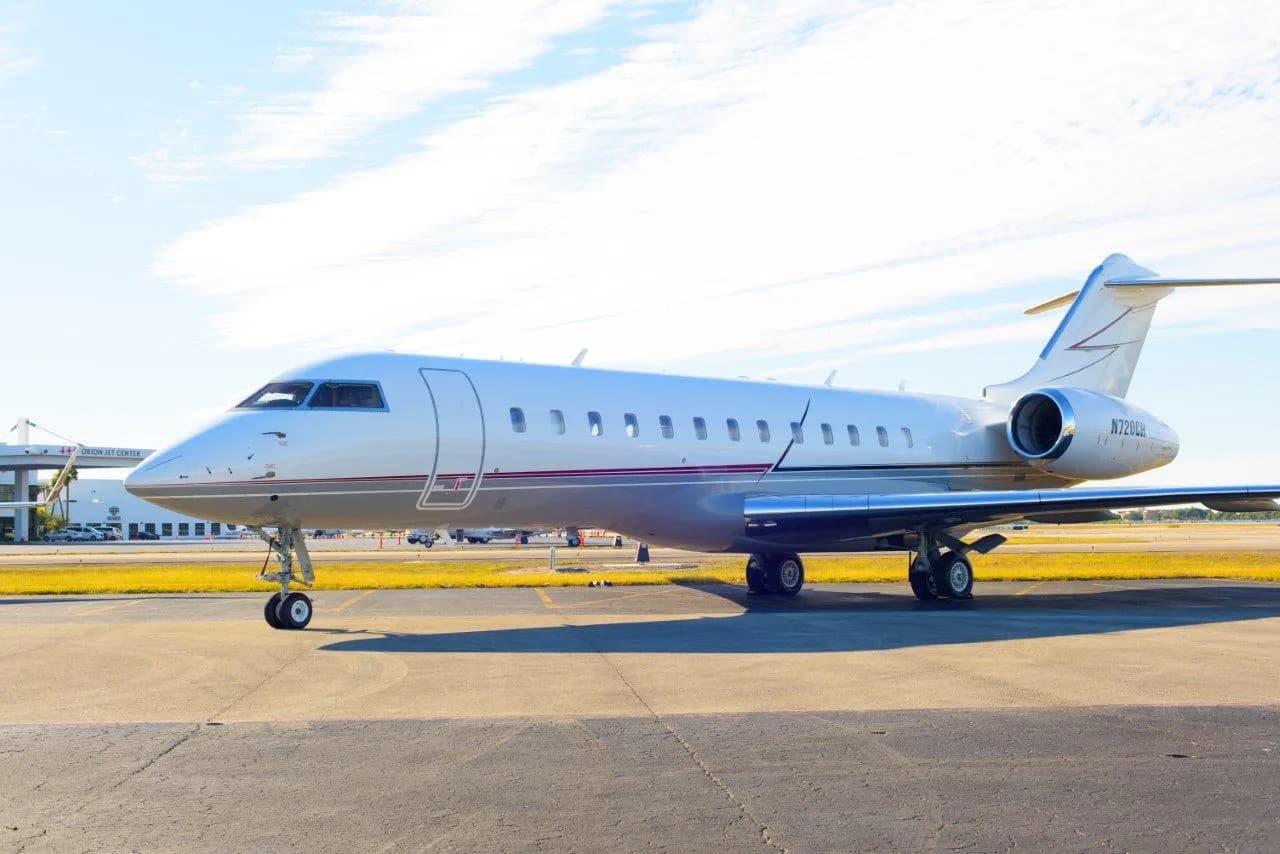 A Bombardier Challenger aircraft is parked on the tarmac.