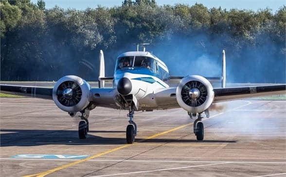 Beechcraft Model 18 with registration N8495A taking off.