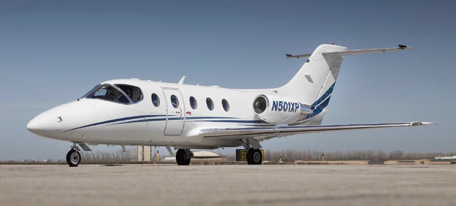 A Hawker 400XP aircraft with registration N501XP parked on the tarmac.