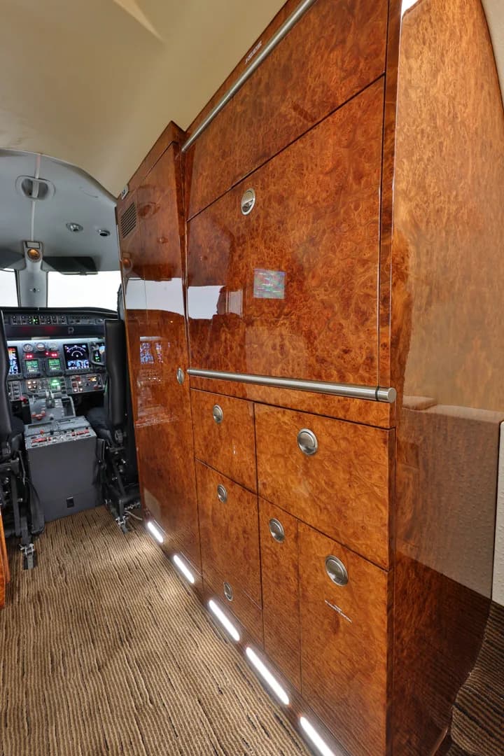Close-up of the wood-paneled storage and cockpit.