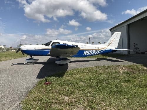 A Piper PA-28-181 Archer II aircraft with registration N503VF parked on the tarmac.