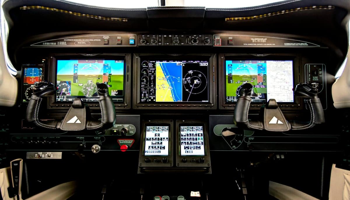Detailed view of the aircraft's glass cockpit instrument panel.