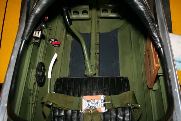 View of the cockpit showing the seat, harness, and controls.