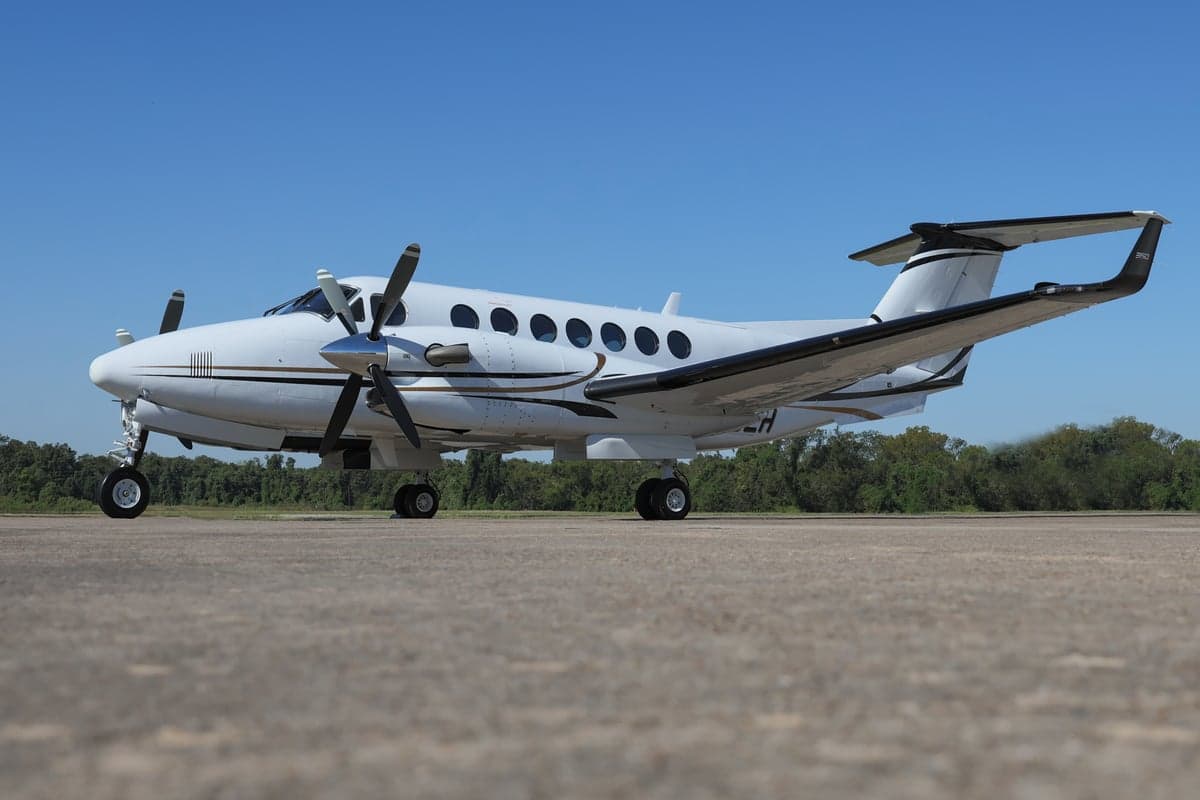 King Air 350 with registration N715LH parked on the tarmac.