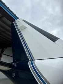 View of the wing of an aircraft in flight.