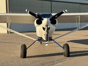 Front view of the CubCrafters XCub N321SY, showing the propeller and landing gear.