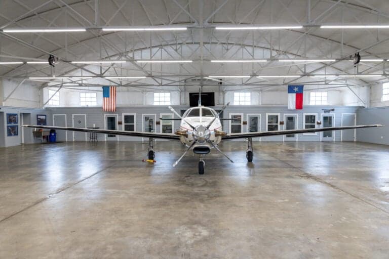 A front view of the N788SM Malibu aircraft in a hangar.