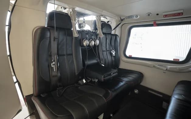Close-up of the helicopter's interior seating arrangement with headsets.
