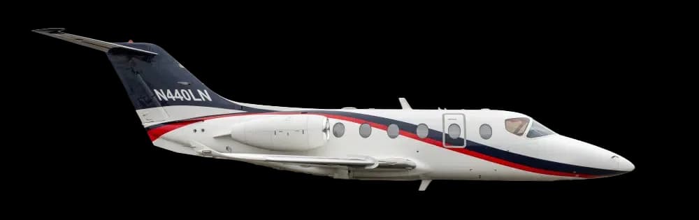 Side view of a white, red, and black jet against a black background.