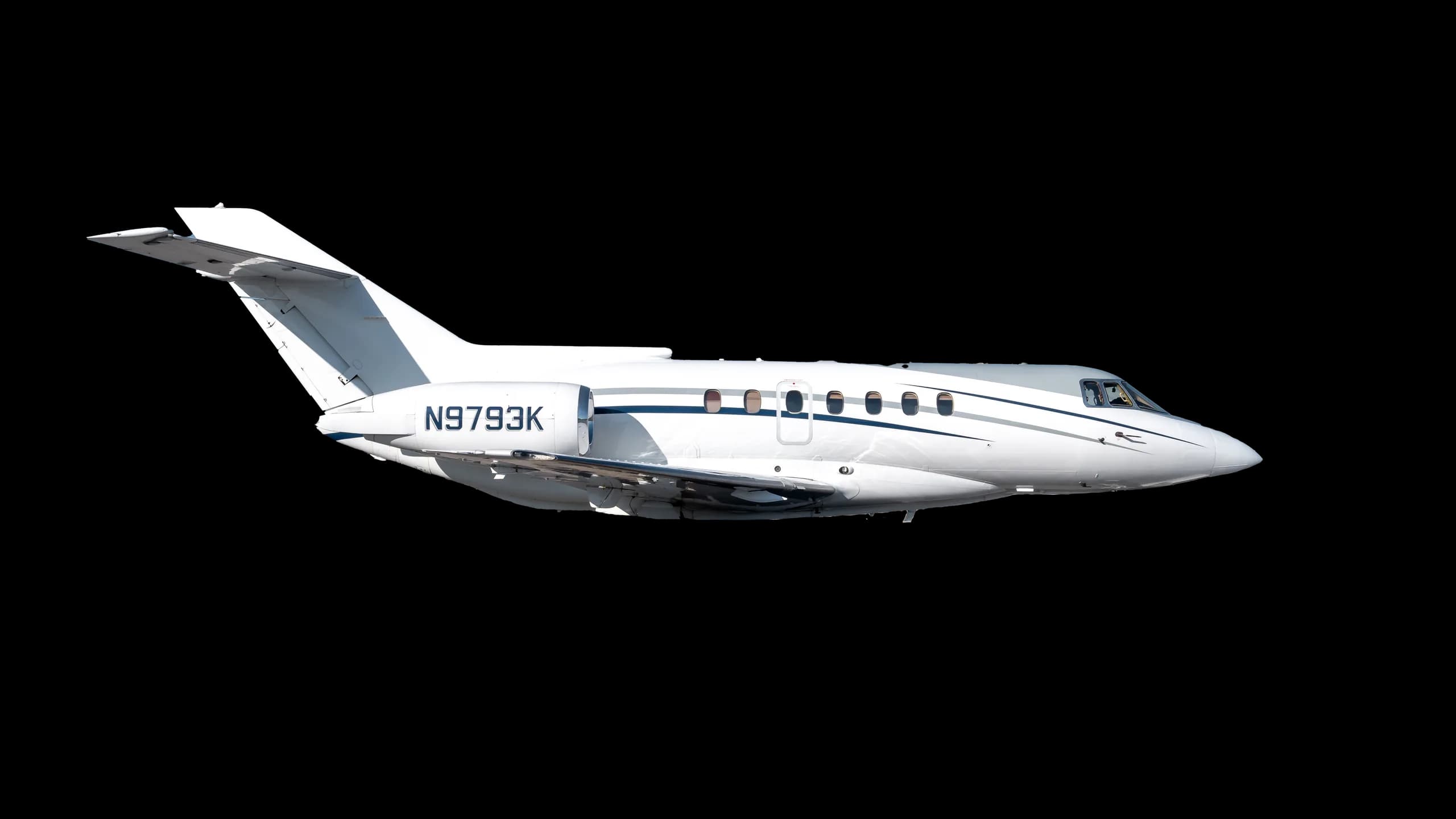 Side view of a white and gray jet with registration N9793K against a black background.