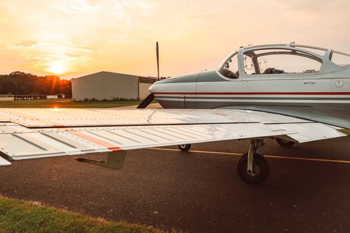 The D-EGWK aircraft is parked on the runway with a gray and white paint scheme.