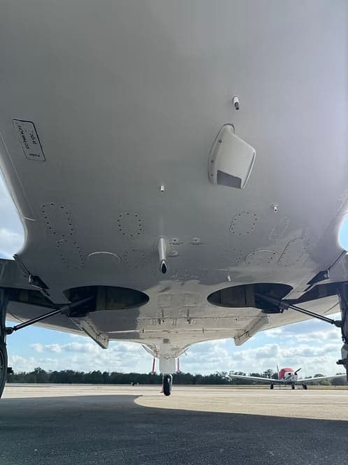 Underside of a Cessna Citation CJ3+ showing landing gear.