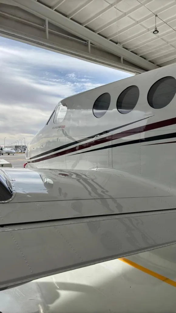 Close-up of the fuselage of a King Air 350 aircraft.