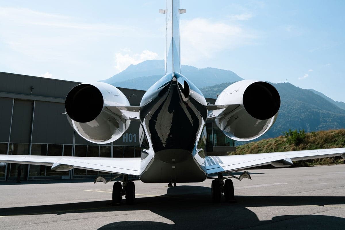 A rear view of a Bombardier Global XRS aircraft with its engines.