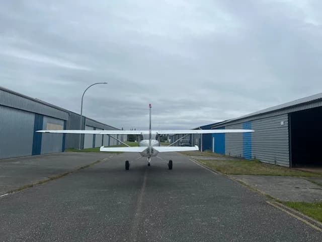 Rear view of the C-FZCE Cessna aircraft parked on the tarmac.