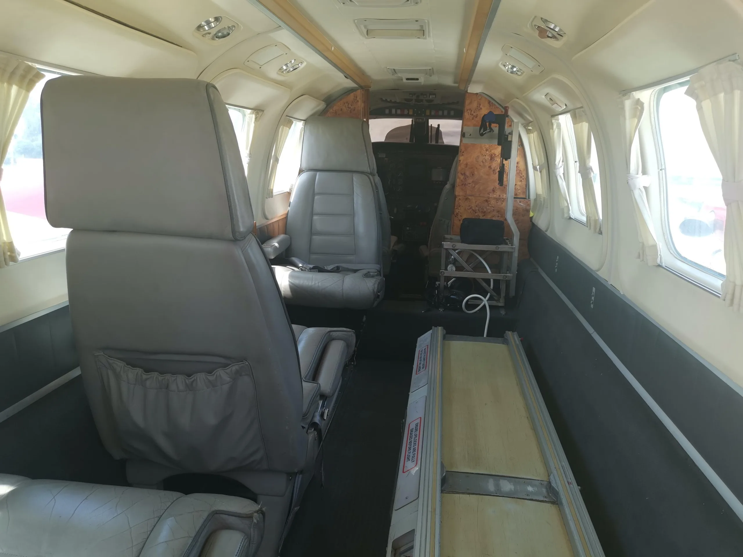 View of the interior cabin with seats and cargo area.