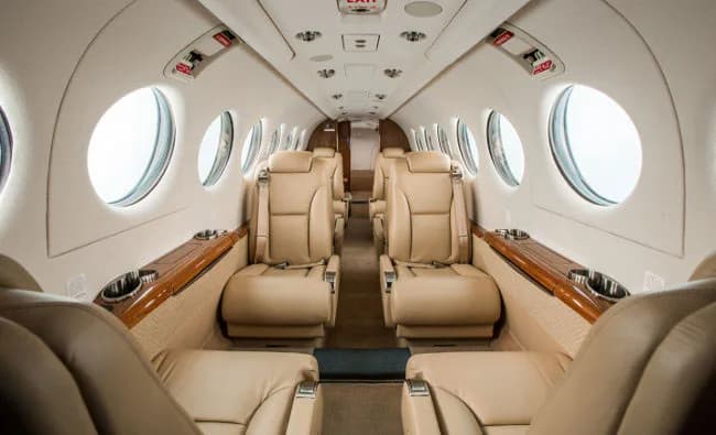 Forward view of the King Air cabin with tan leather seats.