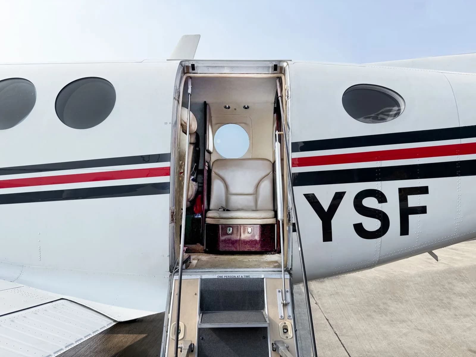 View of the King Air aircraft door and steps leading into the cabin.