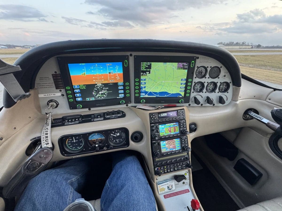 The instrument panel of a Cirrus SR20 aircraft shows the avionics and controls.