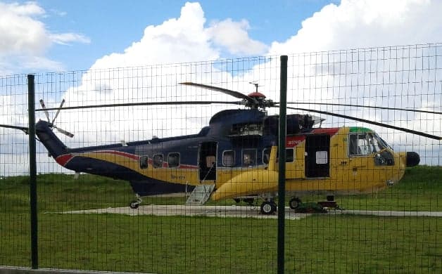 Side view of a Sikorsky S-92 helicopter on the ground.