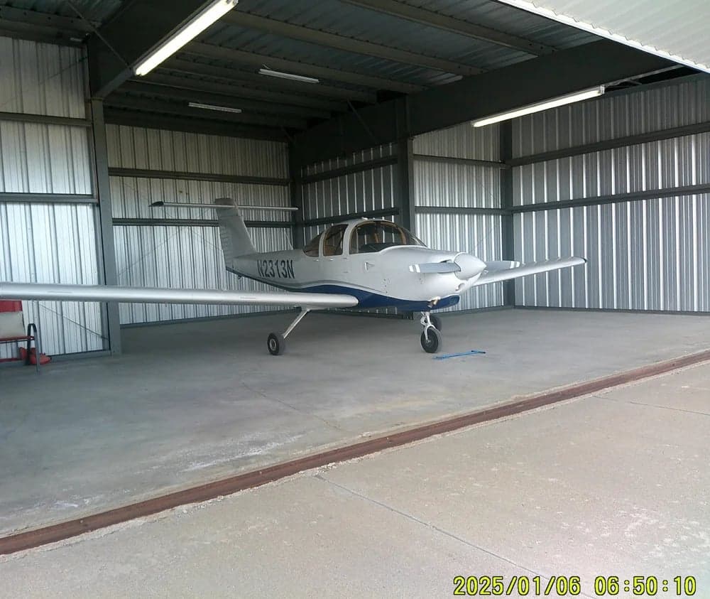 Aircraft N2313N parked inside a hangar.