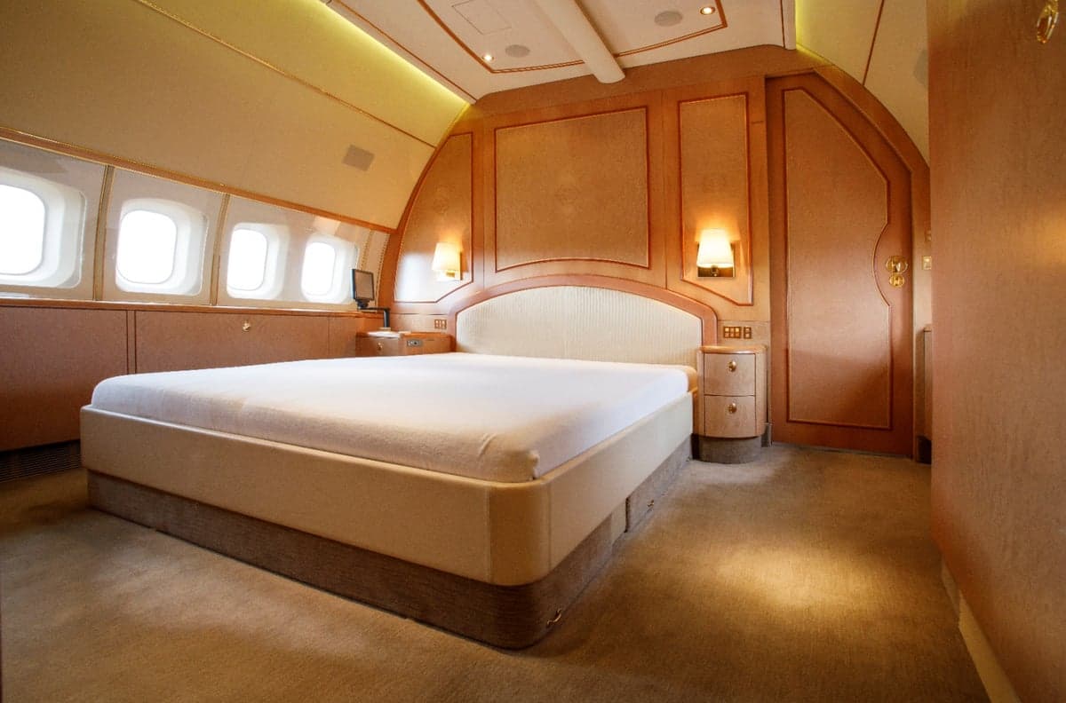 Aircraft interior with a bedroom.