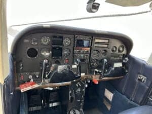 The instrument panel of the Cessna 172 Skyhawk, featuring various gauges and controls.