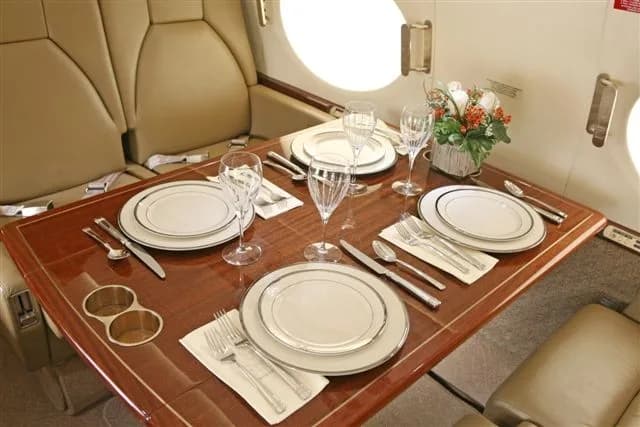 A table is set for a meal inside the aircraft.