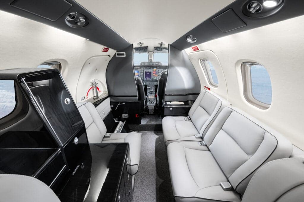 View of the interior of a Piaggio Avanti EVO aircraft, showing the seats and cabin features.