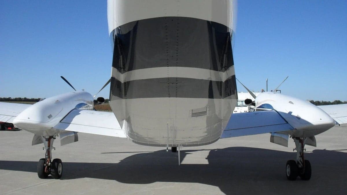 Rear view of the King Air aircraft showing the tail and engine nacelles.