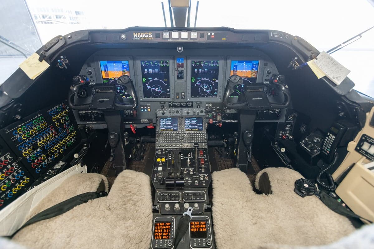 The cockpit of a Learjet 45XR features a full instrument panel and sheepskin seat covers.