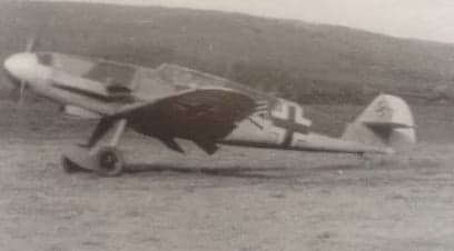 A Bf 109 aircraft on the ground.