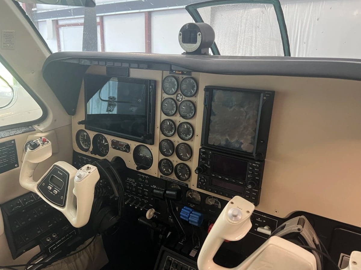 The cockpit of the aircraft features a control panel with various instruments and displays.