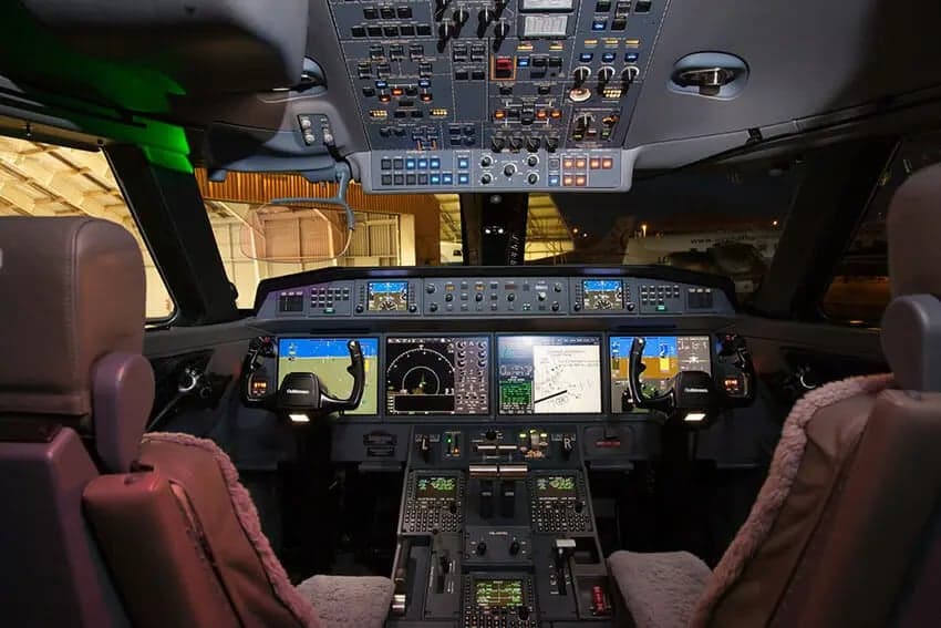 The cockpit of a Gulfstream jet, showing the instrument panel and controls.