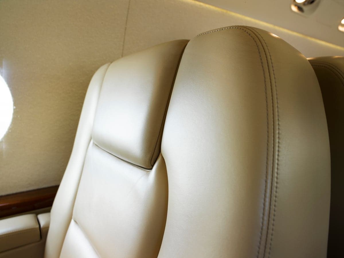 Close-up of the leather seat in the aircraft's cabin.