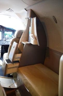 Interior of the Citation Mustang showing a side console and seating.