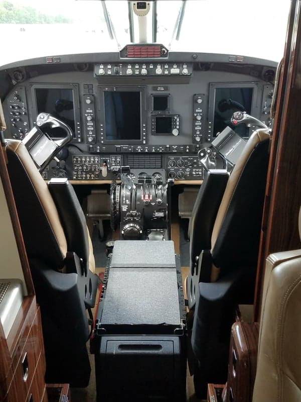 The cockpit of the aircraft features modern avionics and comfortable seating.