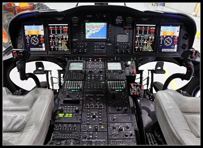 The helicopter's red leather interior features six seats and a table.