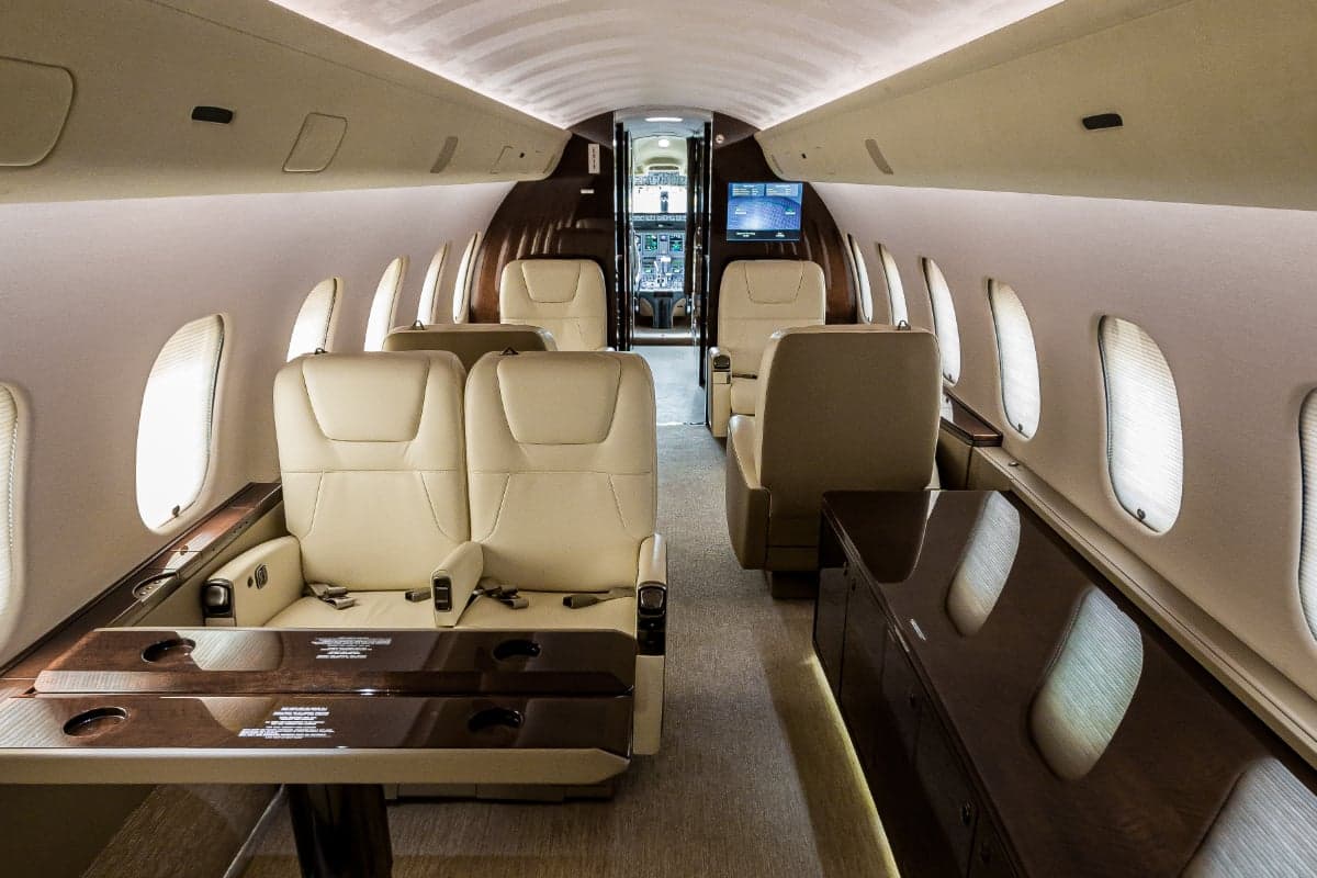 A view of the interior of the aircraft, showing the seating arrangement and cabin layout.