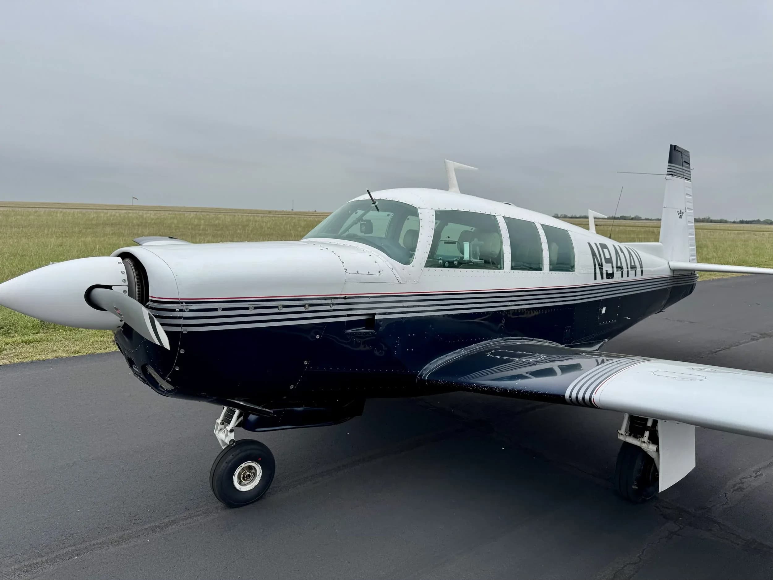 A Beechcraft Bonanza aircraft with registration N9414V is parked on the tarmac.
