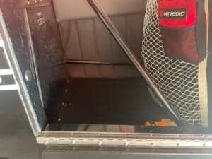 View inside the aircraft's cargo area, showing the frame and interior panels.