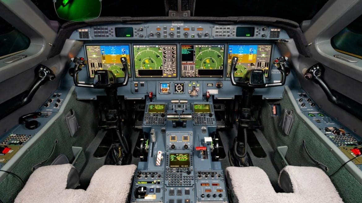 The cockpit of the aircraft features a full instrument panel and controls.