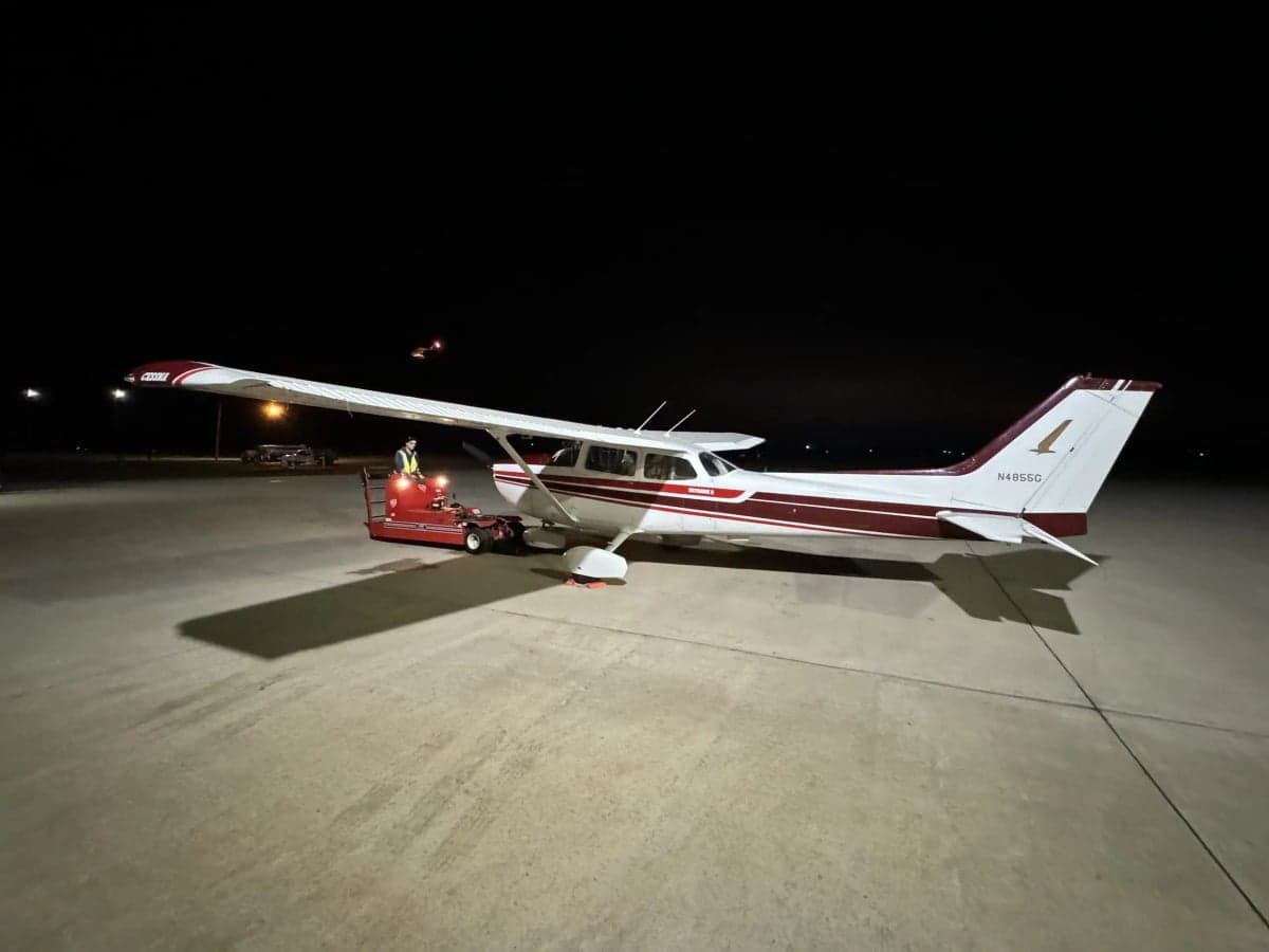 Cessna 172 N4855G being towed at night, showing the tail number.