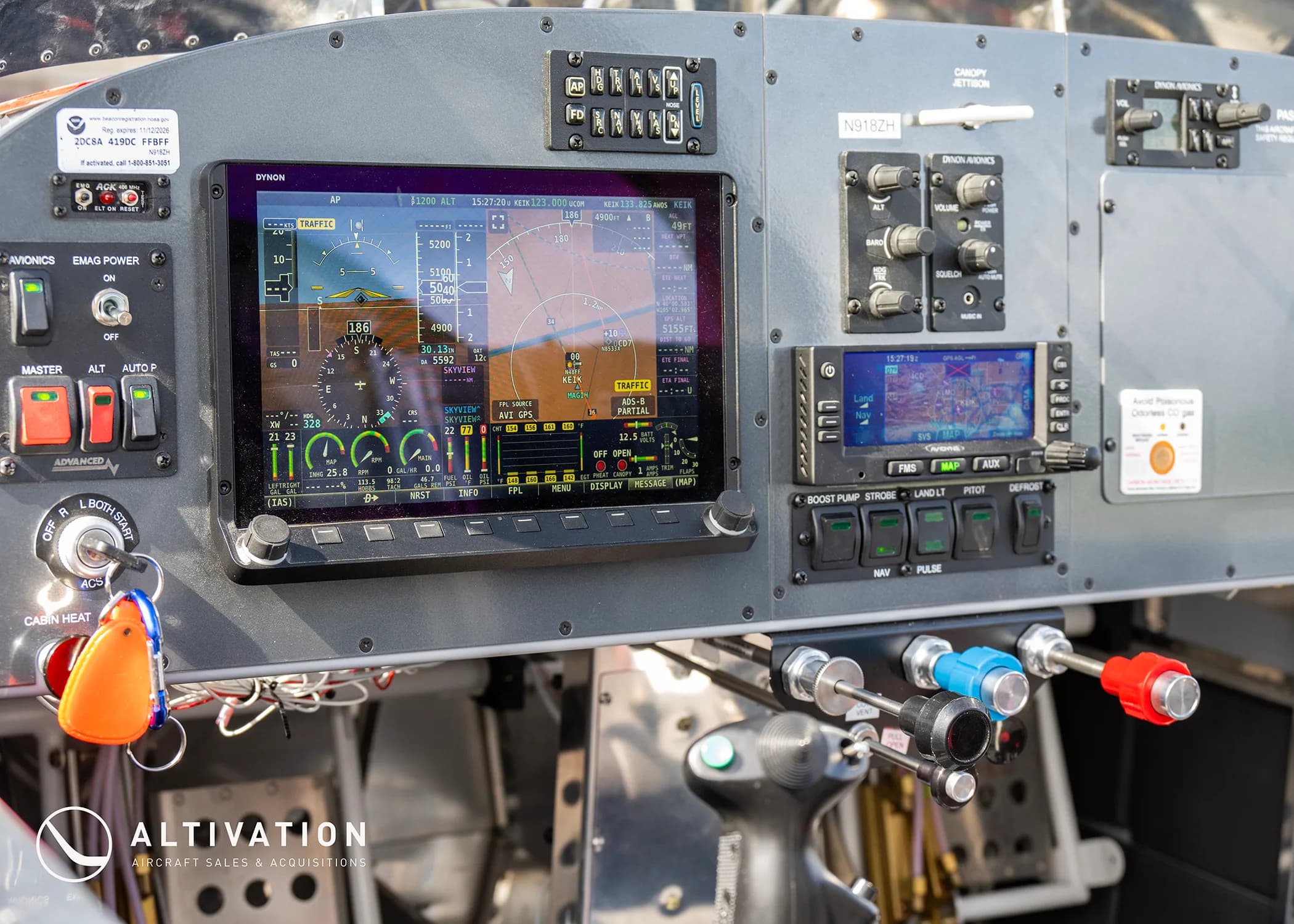 A close-up view of the modern glass panel displays and controls in the cockpit of an experimental aircraft.