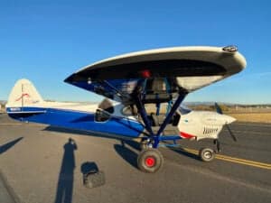 A Cubcrafters aircraft parked on the tarmac.